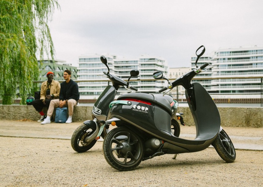 A Coup e-moped parked by the canal in Berlin